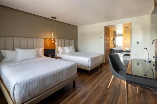 Postel nebo postele na pokoji v ubytování Hotel Real del Rio