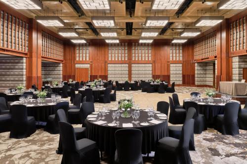 a large ballroom with tables and chairs in a hall at The Westin Warsaw in Warsaw