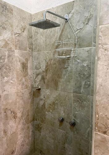 a shower with a glass door in a bathroom at Casa para siete personas en Lo De Marcos, Nayarit in Lo de Marcos