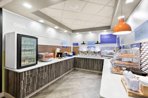a fast food restaurant with a counter with food at Holiday Inn Express Atlanta Galleria-Ballpark Area by IHG in Atlanta