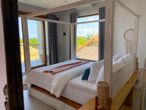 Кровать или кровати в номере Kamana Beach House