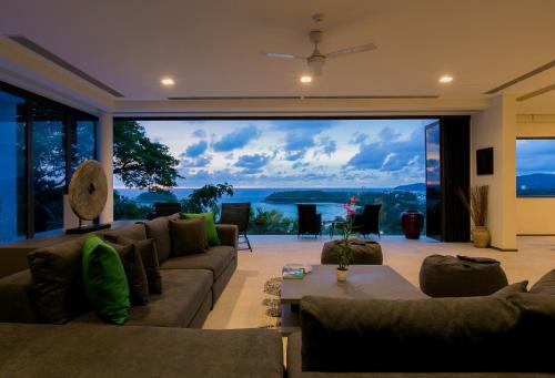 a large living room with a large glass window at The Heights Penthouse A5 3Bedrooms Seaview near Kata Beach in Kata Beach