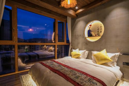 Postel nebo postele na pokoji v ubytování Bed and Breakfast B&B Qianxi 浅喜 SanYa