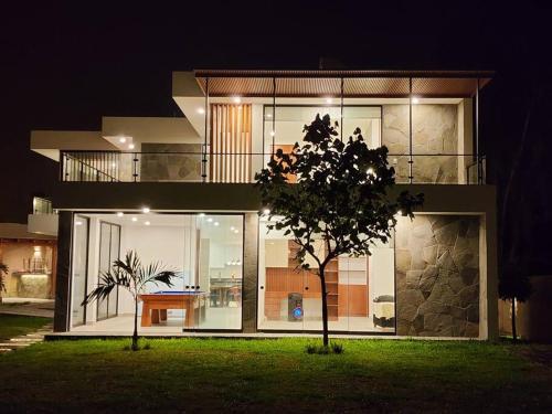 a view of a house at night at Casa de campo de estreno en Cieneguilla, Lima-Perú in Cieneguilla