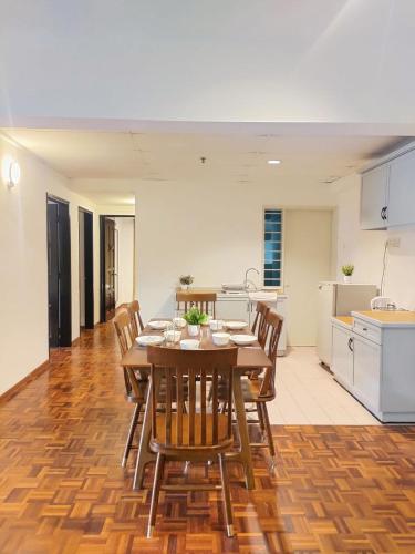 a kitchen and dining room with a table and chairs at Star Regency by Plush in Brinchang