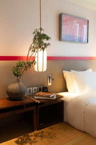Suzu Saigon - A Boutique Hotelにあるベッド