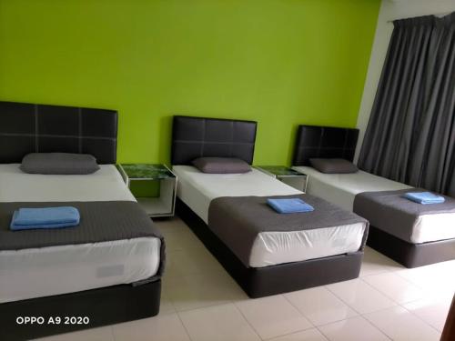 Ένα ή περισσότερα κρεβάτια σε δωμάτιο στο PKA Homestay - Sewa Bilik