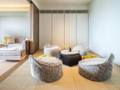 Una cama o camas en una habitación de seven x seven ISHIGAKI