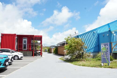 a row of colourful houses in a parking lot at Painushima Resort in Ishigaki Island