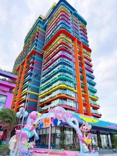 a large building with a rainbow colored building at Flamingo Hai Tien in Hoằng Hóa
