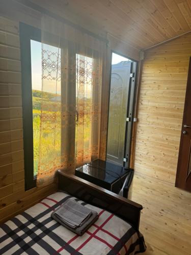a room with a bed with a window and a mirror at Eco Aura (rest zone / Sevan / Отдых) in Areguni