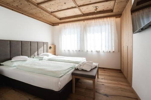 Postel nebo postele na pokoji v ubytování Aparthotel Zum Schlössl