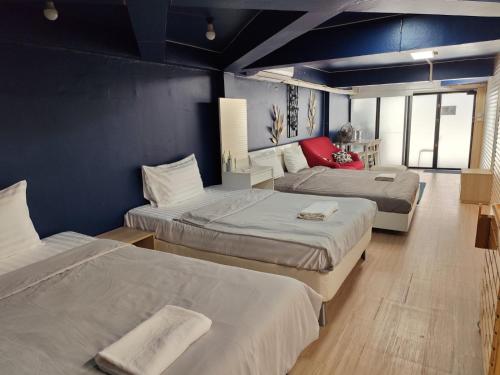Ένα ή περισσότερα κρεβάτια σε δωμάτιο στο Doodle Lodge Bangkok