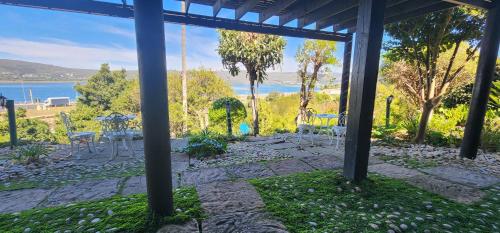 a patio with a view of the water at Lagoon Lodge in Knysna