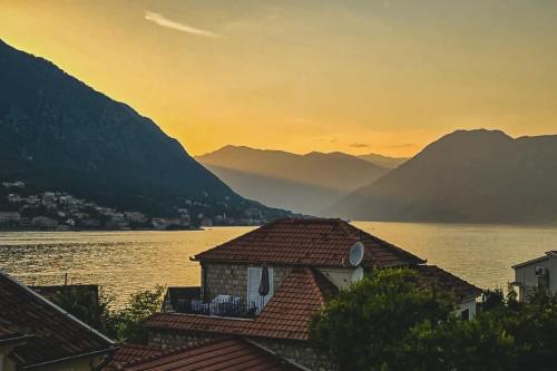a view of a lake with mountains in the background at Lux Seaside Residence in Kotor