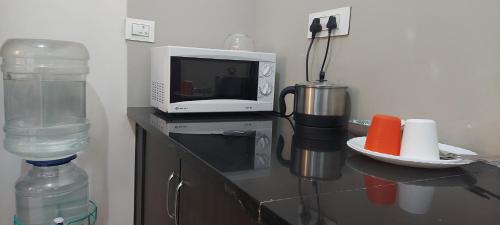 Kuchyň nebo kuchyňský kout v ubytování Tranquil Serviced Apartments
