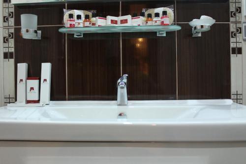 
a bathroom with a sink and a bathtub at Modern Hotel in Baku
