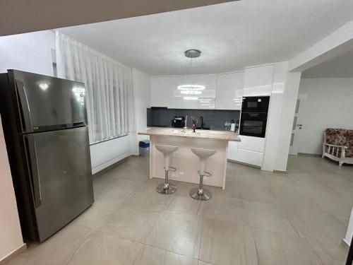 a kitchen with a stainless steel refrigerator and a counter at Beautiful Villa near Medjugorje in Međugorje