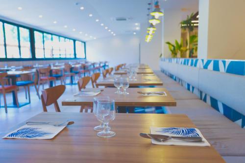 a row of tables and chairs in a restaurant at Eurosalou & Spa in Salou