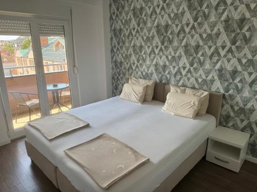 Postel nebo postele na pokoji v ubytování T lux apartman