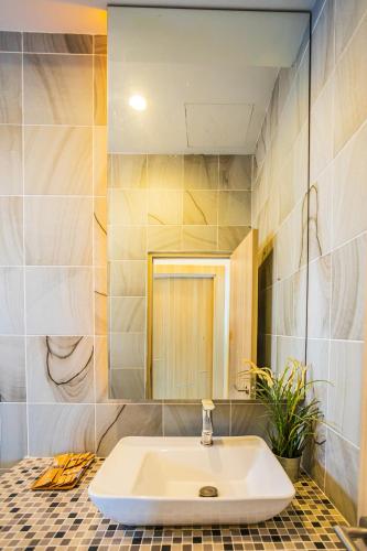a bathroom with a sink and a mirror at "Smooth as Silk" Gorgeous 3-Bedroom Pool Villa, Just a Stone's Throw from the Beach! in Ban Khlong Haeng