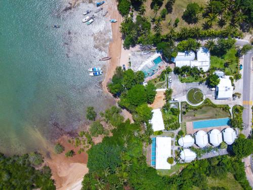 an aerial view of a beach with boats in the water at Arawan Beach Resort Krabi in Ao Nam Mao