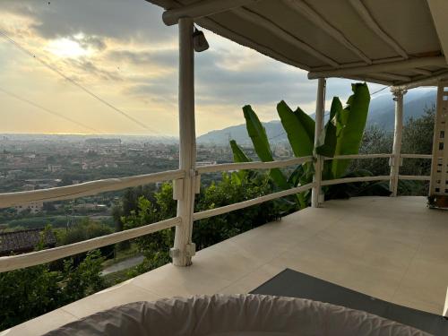 a balcony with a view of a city at Villa Patrizia Pietrasanta in Pietrasanta
