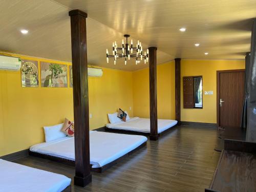 Postel nebo postele na pokoji v ubytování Vườn Gióng Homestay