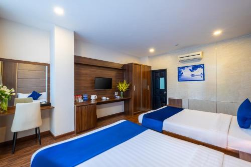Postel nebo postele na pokoji v ubytování Sandals Hotel