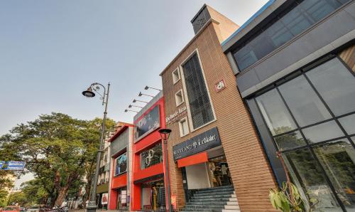 a building on a city street with a store at Itsy Hotels Deluxe Inn in Chennai
