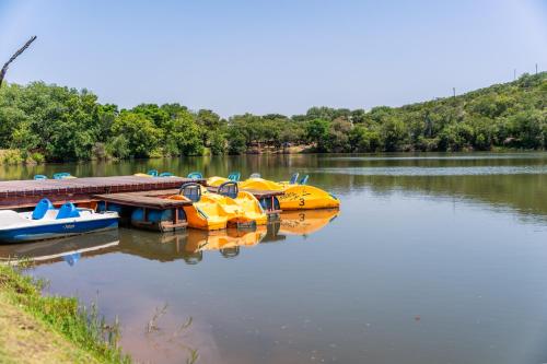 a group of boats parked at a dock on a lake at ATKV Klein-Kariba in Bela-Bela