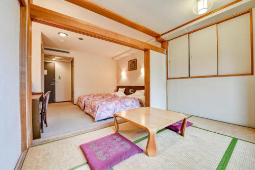 Postel nebo postele na pokoji v ubytování バートンホテル Barton Hotel