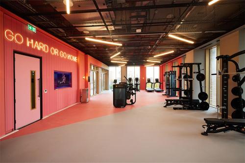 a gym with lots of treadmills and machines at Charles Hope Brighton & Hove in Brighton & Hove