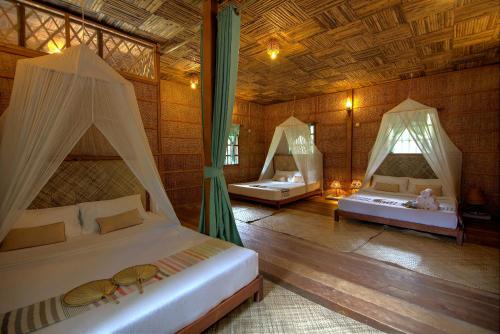 棕櫚村Spa度假酒店房間的床