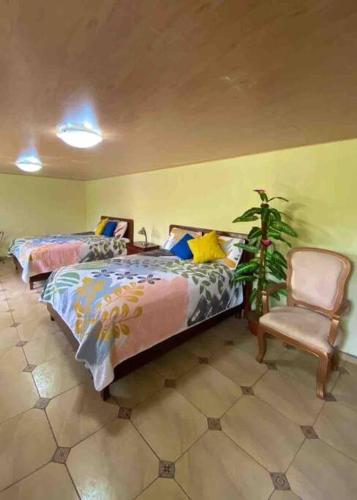 En eller flere senge i et værelse på Guesthouse in Bosques de Santa Elena 2