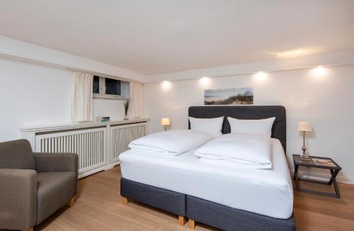 Postel nebo postele na pokoji v ubytování Sylthaus