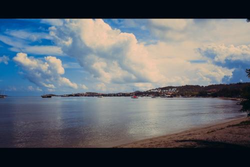 a view of a large body of water with clouds at The Shore Samui in Bang Rak Beach