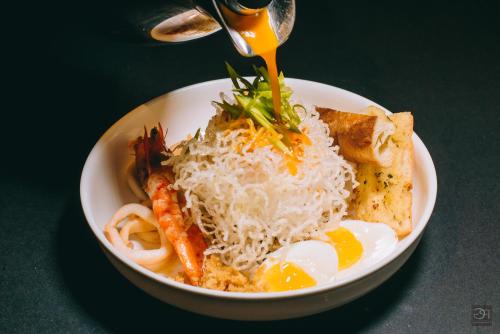 a plate of food with eggs and vegetables and rice at Best Western Plus The Ivywall Hotel - Palawan in Puerto Princesa City