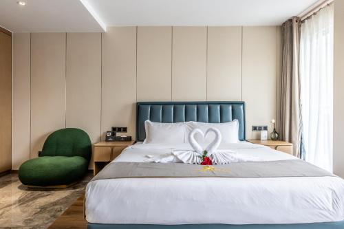 Katil atau katil-katil dalam bilik di Bole Jing Pin Hotel