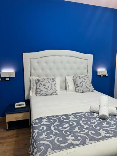 Postel nebo postele na pokoji v ubytování Hotel Veronese