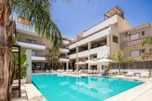 an image of a swimming pool in front of a building at Sapphire Blue Suites in Kissamos