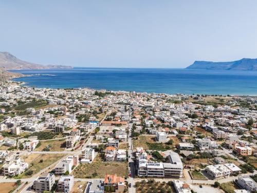 an aerial view of a city and the ocean at Sapphire Blue Suites in Kissamos