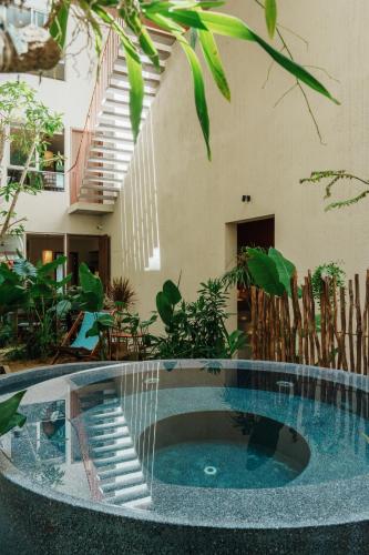 a swimming pool in the middle of a house at Camfusion House in Hoi An