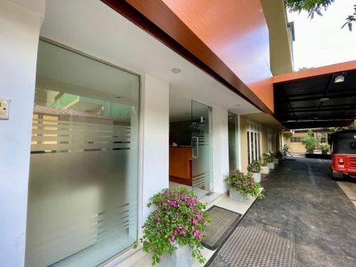 a building with flowers on the side of it at Havelock City Hostel, Colombo in Colombo