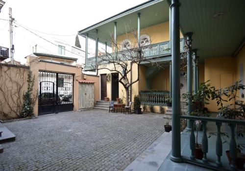 an empty courtyard of a building with a balcony at Tonik in Tbilisi City