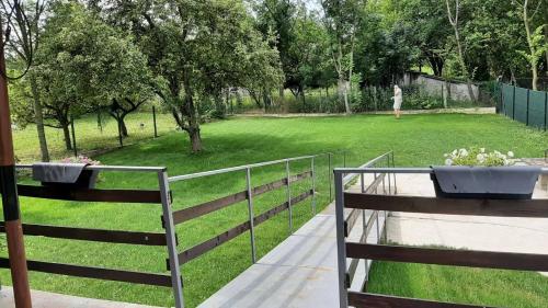 a fence with a park in the background at Green sanctuary 30 min from downtown Belgrade in Donja Ralja