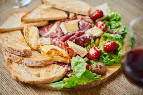 a plate of food with a sandwich and a salad at Milford Hall Salisbury in Salisbury