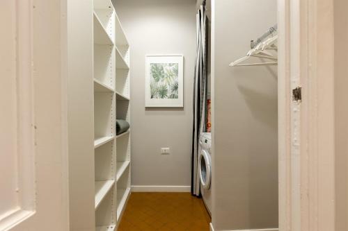 a laundry room with a washer and dryer at Rome as you feel - Grotta Pinta apartments in Rome
