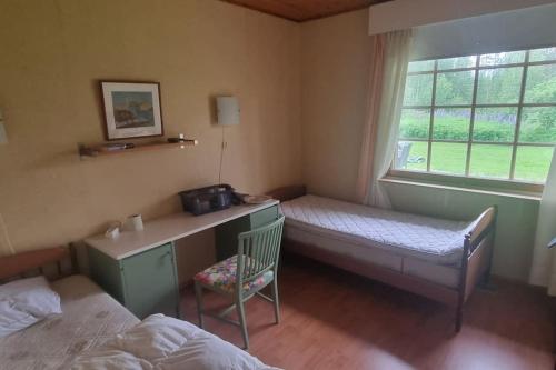 Giường trong phòng chung tại Villa Sierijärvi