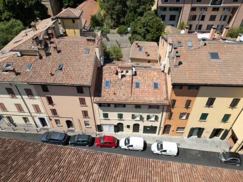 an aerial view of cars parked in a city at BolognaRoomscom - Frassinago Deluxe in Bologna